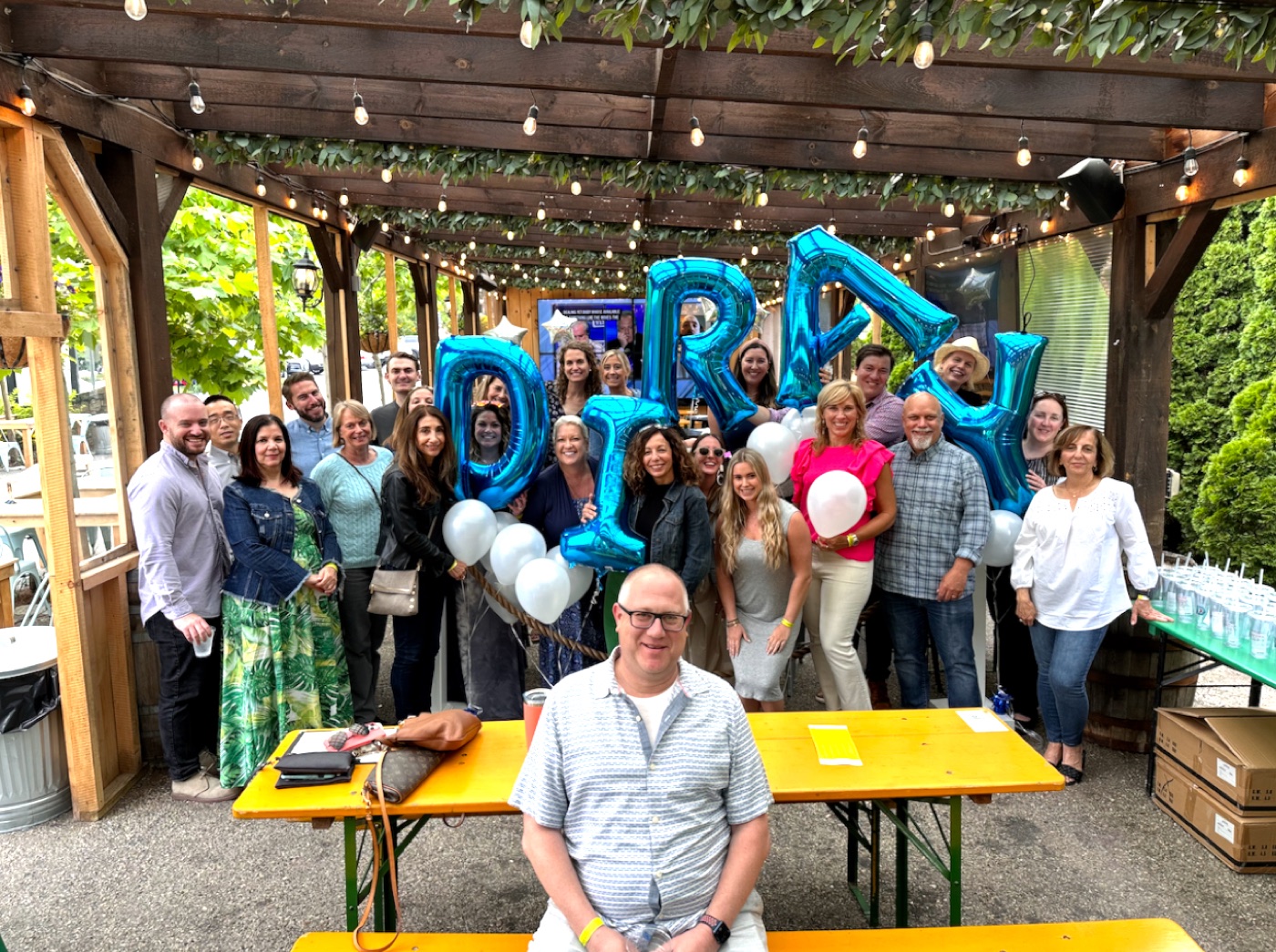 The Diray Media team celebrating together under Diray balloons